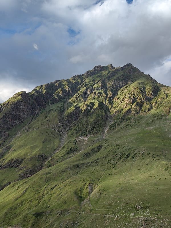High-altitude motorcycle ride through Gramphu's rugged mountain valley