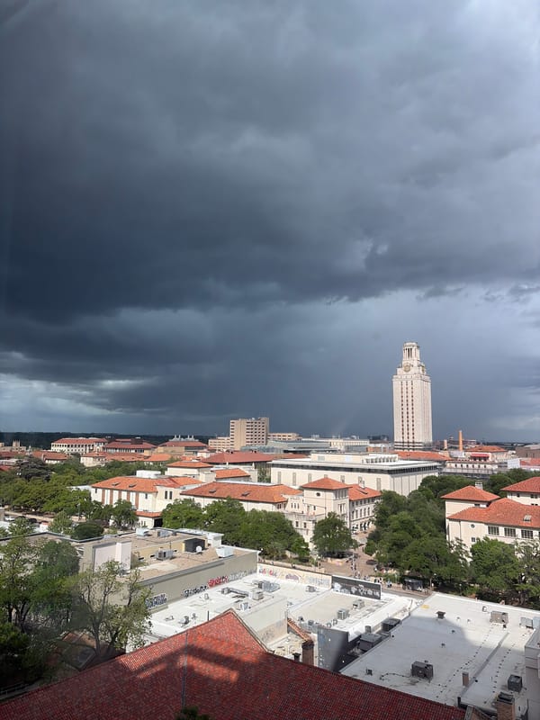 Storm front creates dramatic skies over Austin campus, downtown