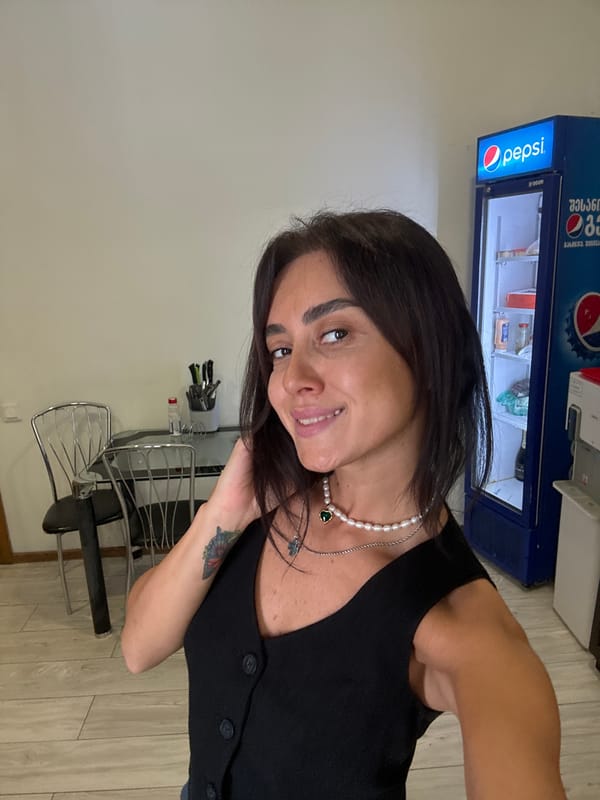 Selfie series from a Tbilisi balcony and apartment, July 2026