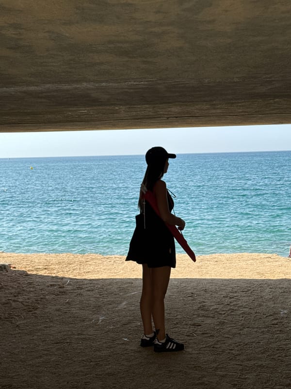 Beach morning in Arenys de Mar, graffiti and shoreline.
