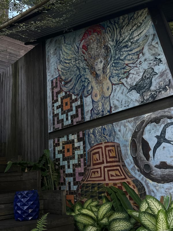 Diner documents ornate restaurant murals and courtyards in Singakerta