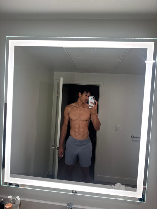Man documents morning skincare routine in Los Angeles bathroom