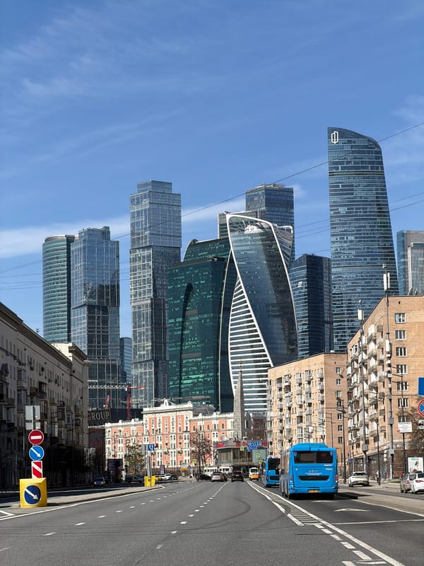Morning traffic flows through Moscow intersection under clear skies