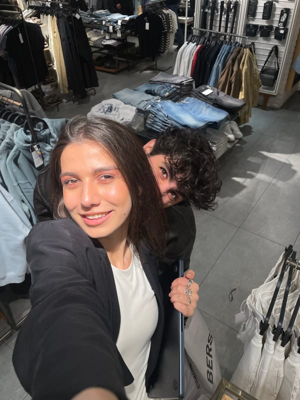 Couple takes mirror selfies while shopping in Yerevan store
