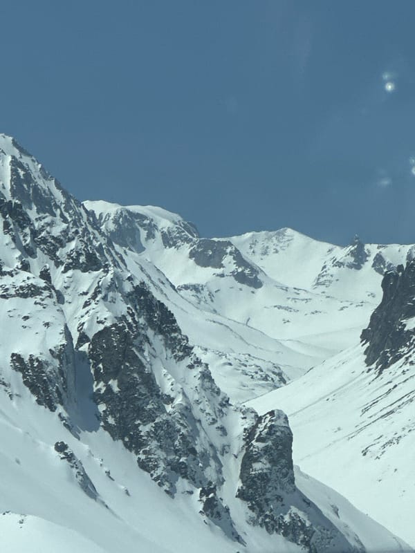Snow-covered mountains documented under clear skies in Kajaran, Armenia