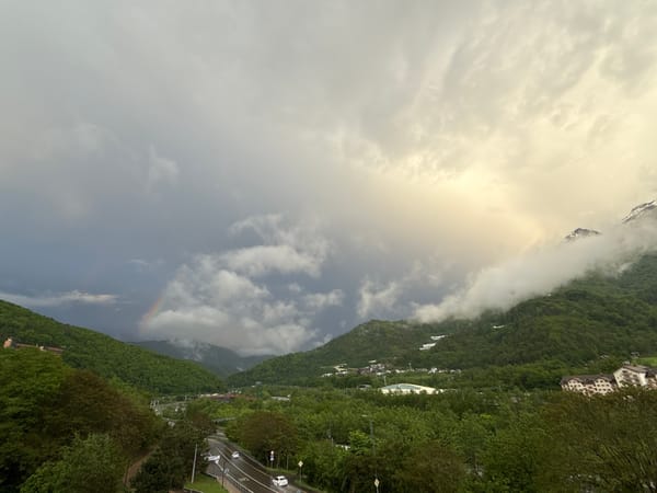 Rainbow appears over Krasnaya Polyana mountains in Russia