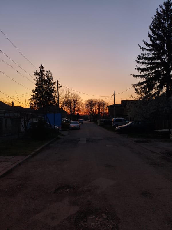 Sunset captured on unpaved residential street in Dobrich, Bulgaria
