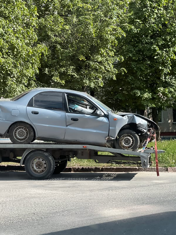 Vehicle accident aftermath and portrait photography documented in Ternopil