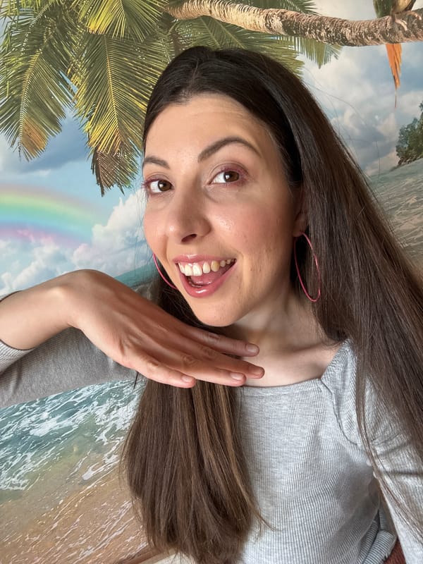 Woman photographed in portrait shots with pink accessories