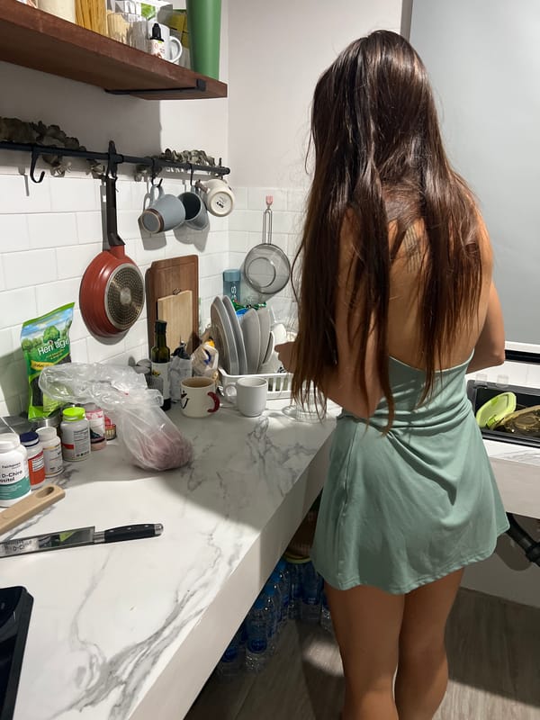 Woman cooking at home in Ban Bang Rak, Thailand