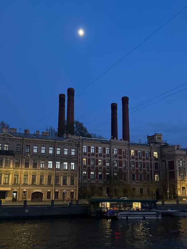 Evening moon rises over Saint Petersburg waterfront walkway