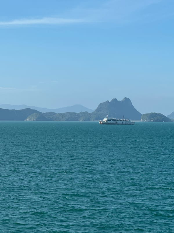 Ferry crossing calm turquoise waters off the Thai island coast