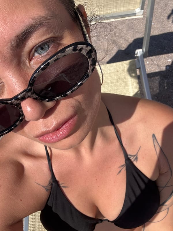 Woman enjoys beach day with puppy at Montenegro resort