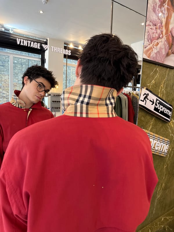 Shopper tries on Burberry at London vintage store