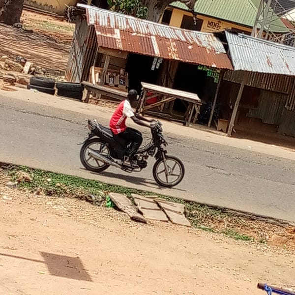 Street life documented: motorcycles, markets, wedding announcements observed