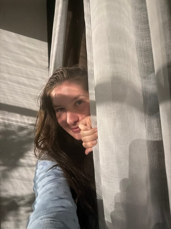 Woman observed in bedroom setting in Staraya, Russia