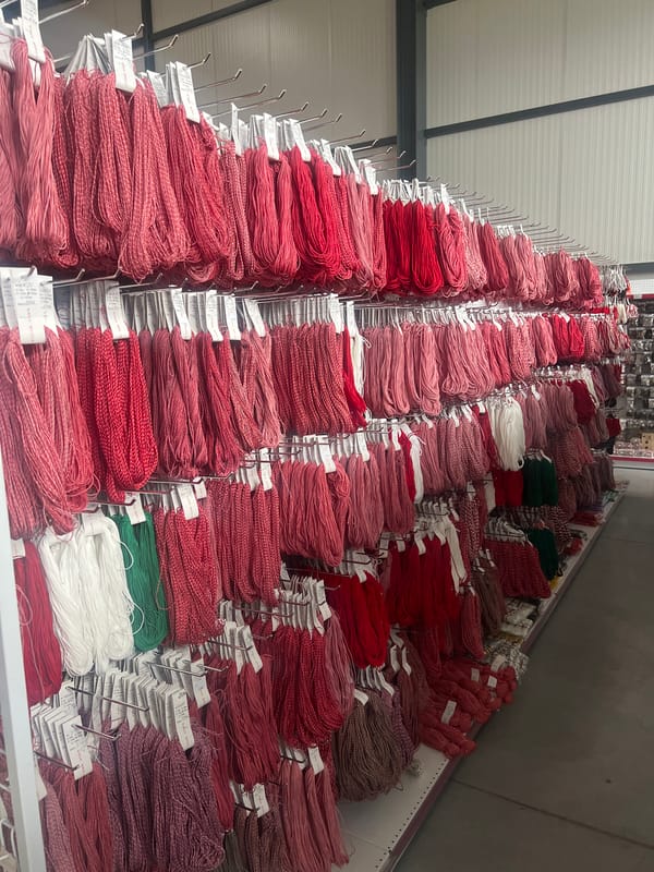 Textile warehouse stocked with red embroidery thread in Burgas