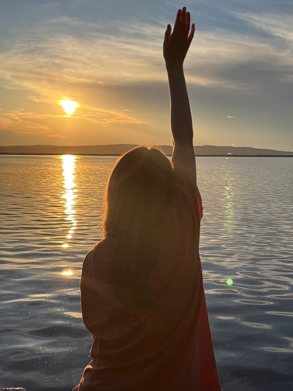 Sunset gestures captured by lakeside witnesses during evening hours