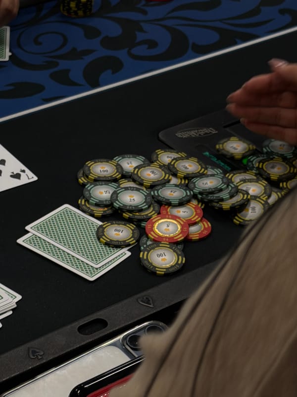 Late-night poker game captured on felt table in NYC