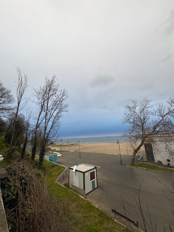 Person spends time at Burgas beach near breakwater structures