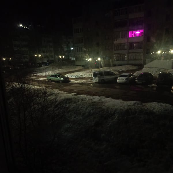 Nighttime residential scenes and sleeping cat in Марковský, Russia