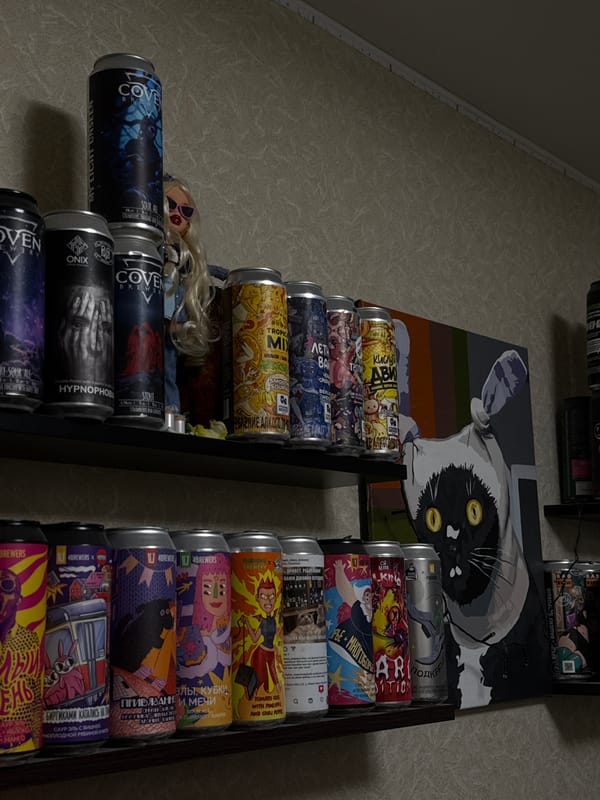 Cat-themed hangout spot with neon lights and stacked cans