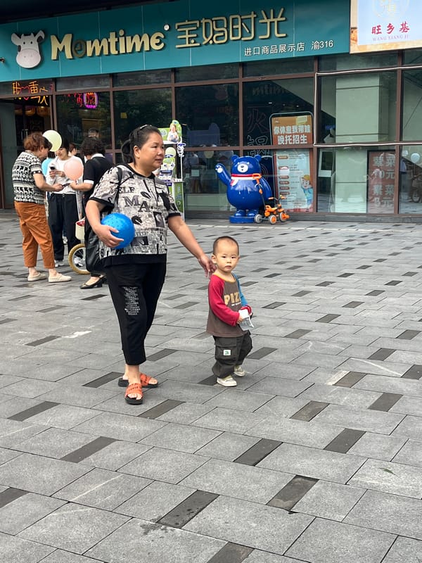 Families and kids fill a Yuzhong District commercial plaza