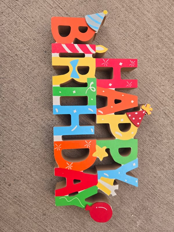 Birthday celebration documented alongside urban street scenes