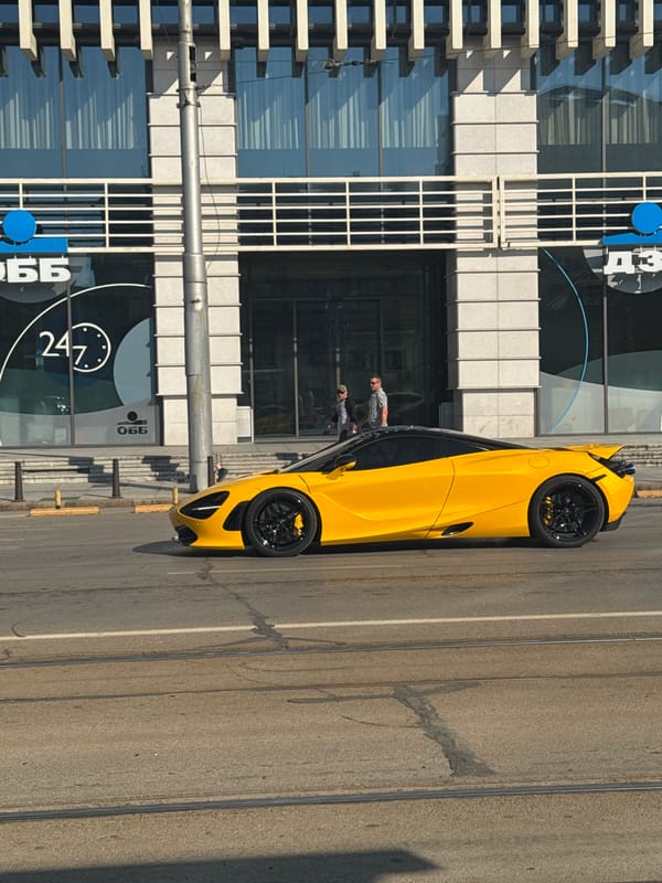 Yellow sports car parked near Sofia's Interpred World Trade Center