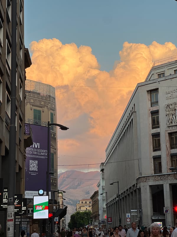 Golden sunset cloud dominates the sky over Palermo streets