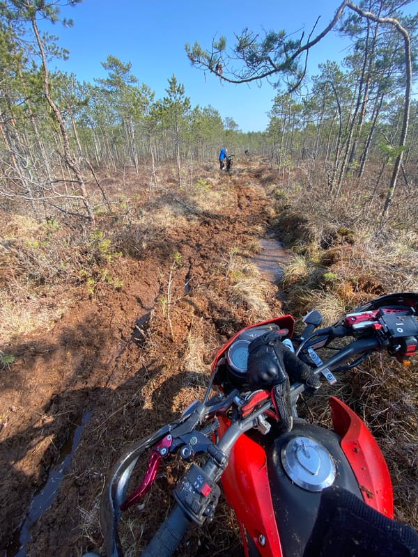 Dirt bike overturns on muddy trails in Belarus