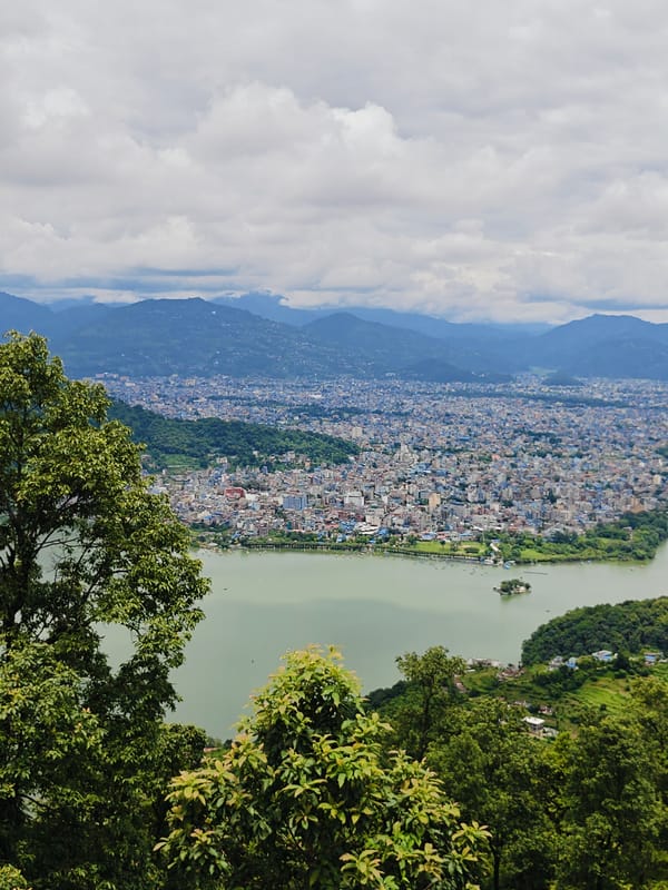 Hilltop views of Pokhara, Phewa Lake, and rural hillside life