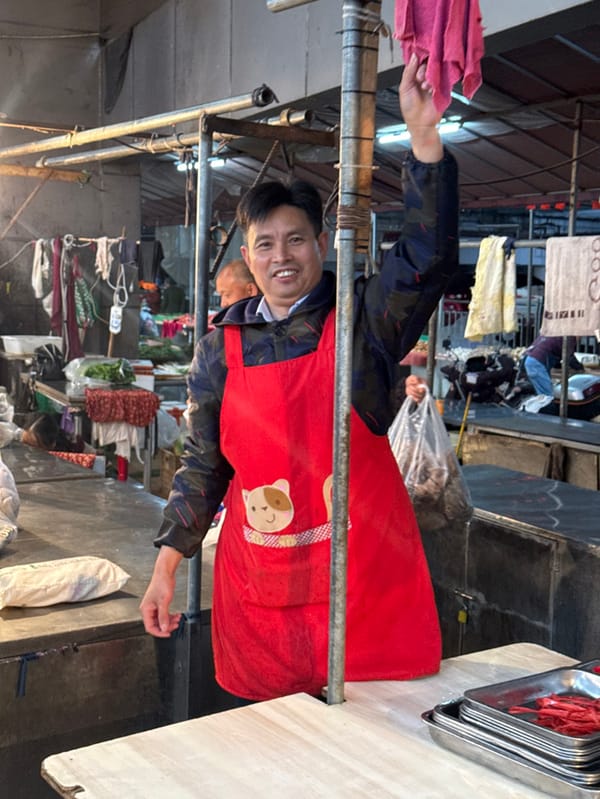 Morning life continues in rain-soaked Jiangjin markets and streets