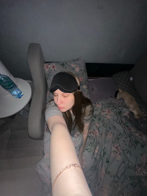 Woman rests with sleep mask in Chaikovsky bedroom
