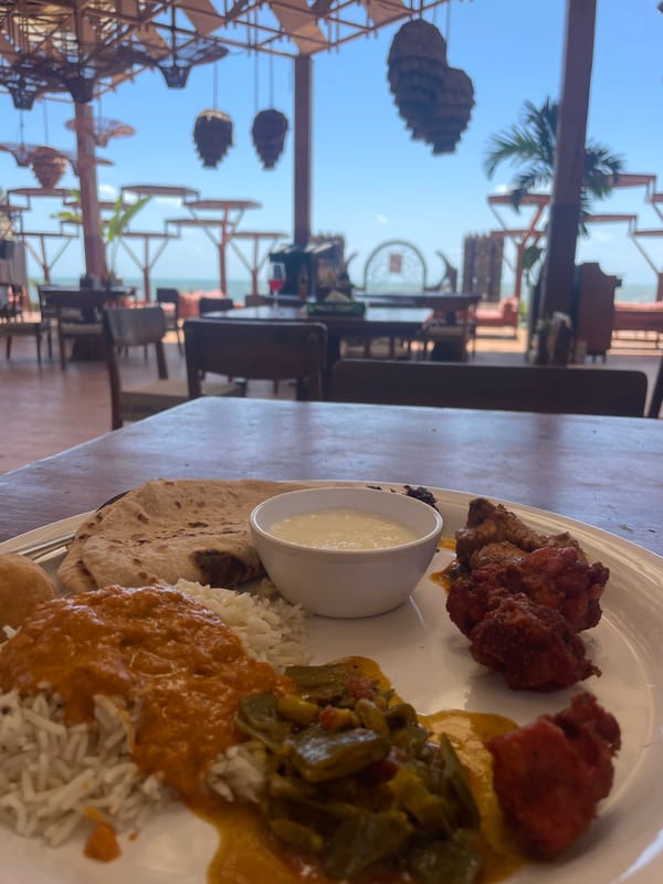 Traditional meal and ornate emblem documented in Chopdem, India