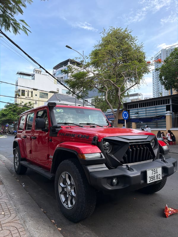 Street traffic and parked Jeep on a Nha Trang morning