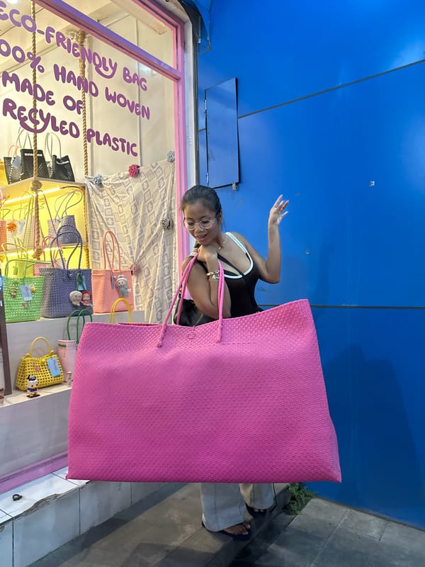 Woman shops eco-friendly bags in Ubud tourist district