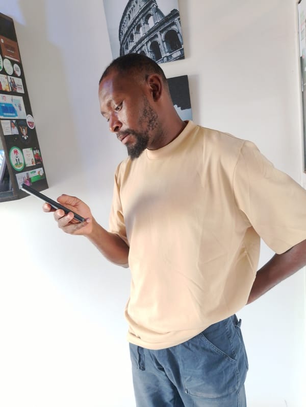 Afternoon hangout in a Jos room, phones out, election posters up
