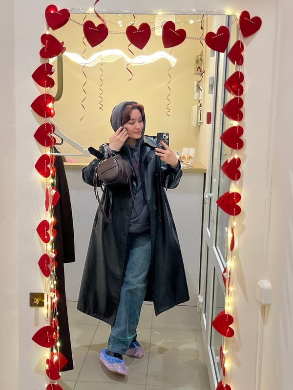 Person poses in heart-decorated room in Neftekamsk