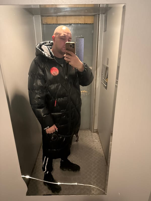 Man Takes Mirror Selfie in Grey Interior Space, Pleven