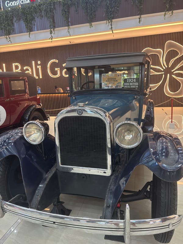 Vintage car exhibition showcases classic automobiles at Bali shopping mall