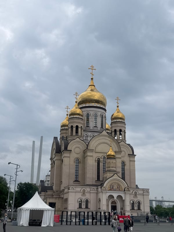 Street life and golden domes across central Vladivostok
