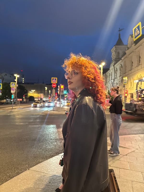 Dusk foot traffic on a wide Moscow street, July 2026