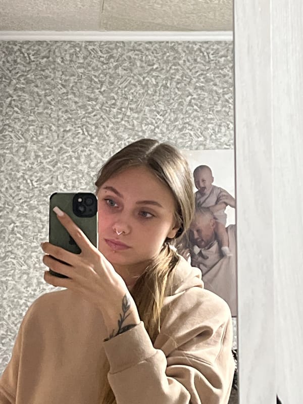 Woman takes bathroom mirror selfie in Foki, Russia