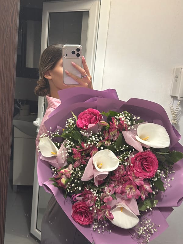 Woman Takes Mirror Selfies With Flower Bouquet in Sofia