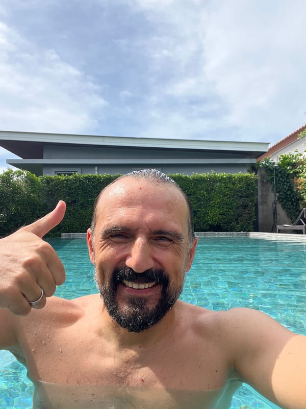 Man enjoys morning swim session in Thai pool