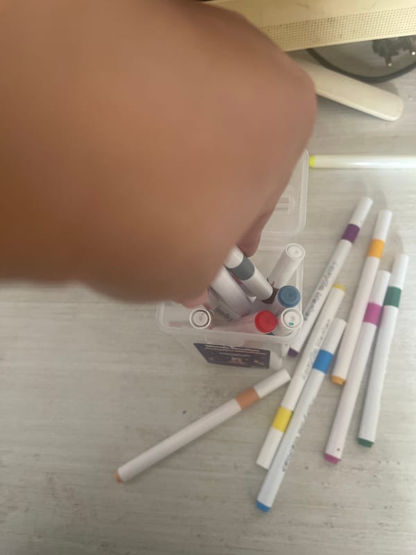 Sorting markers, snacking, and hanging with the cats