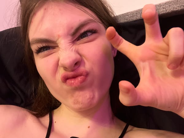 Woman documents evening selfie session with cat in Saint Petersburg