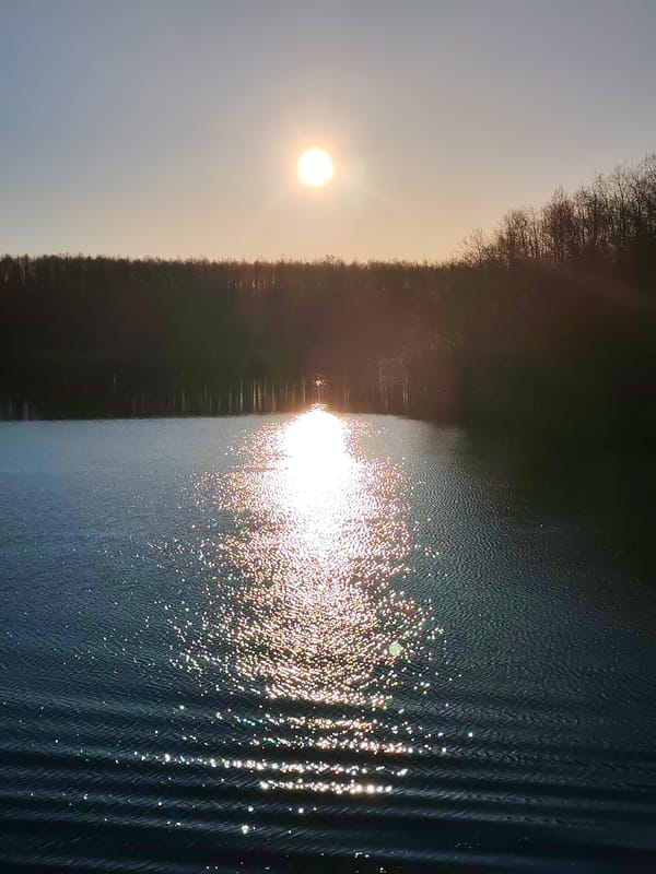 Sunset reflection photographed over water in Kurdiug, Russia