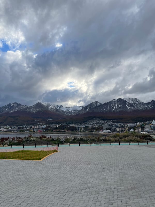 Overcast skies with sunlight observed over Ushuaia mountains